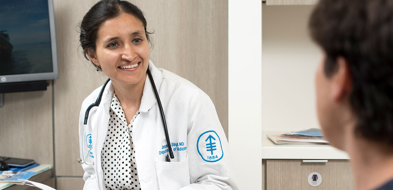 Medical colleague talking to another person