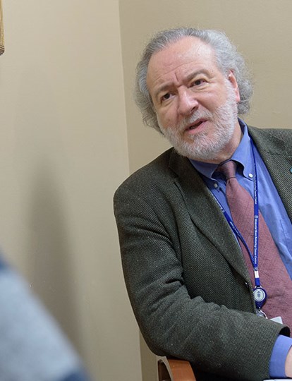 MSK Colleague in a suit talking to another person