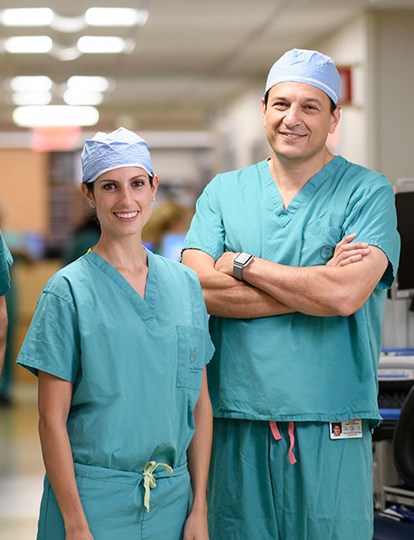 Three MSK Colleagues in green scrubs smiling
